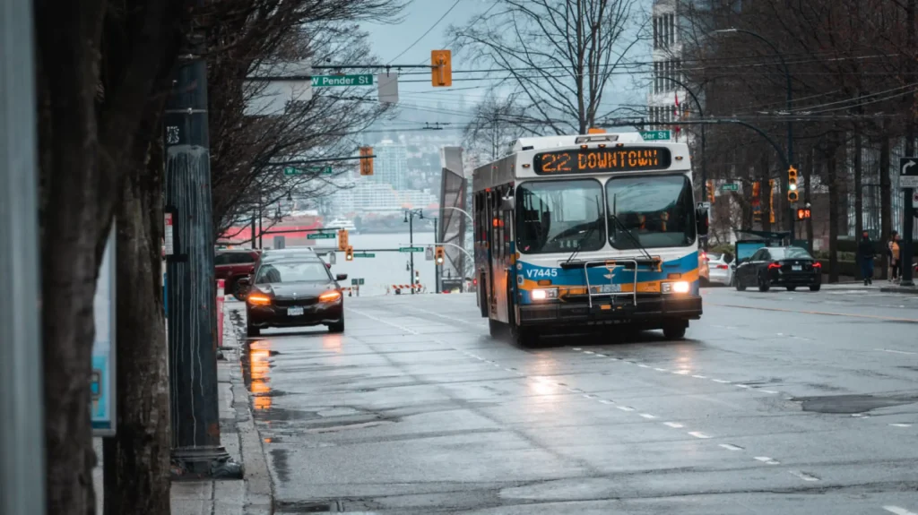 City bus driving on busy street