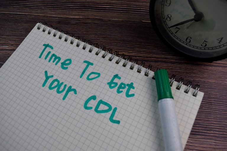 Graph notepad and green marker, "Time to Get Your CDL" written down