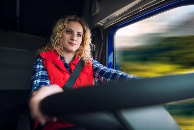 woman driving truck vehicle